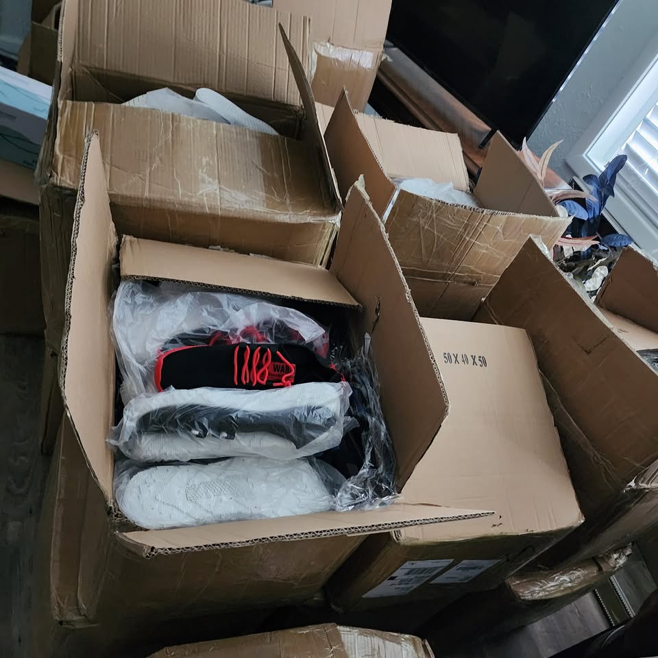 Boxes of donated shoes prepared by Hilltops Ten Toes Down